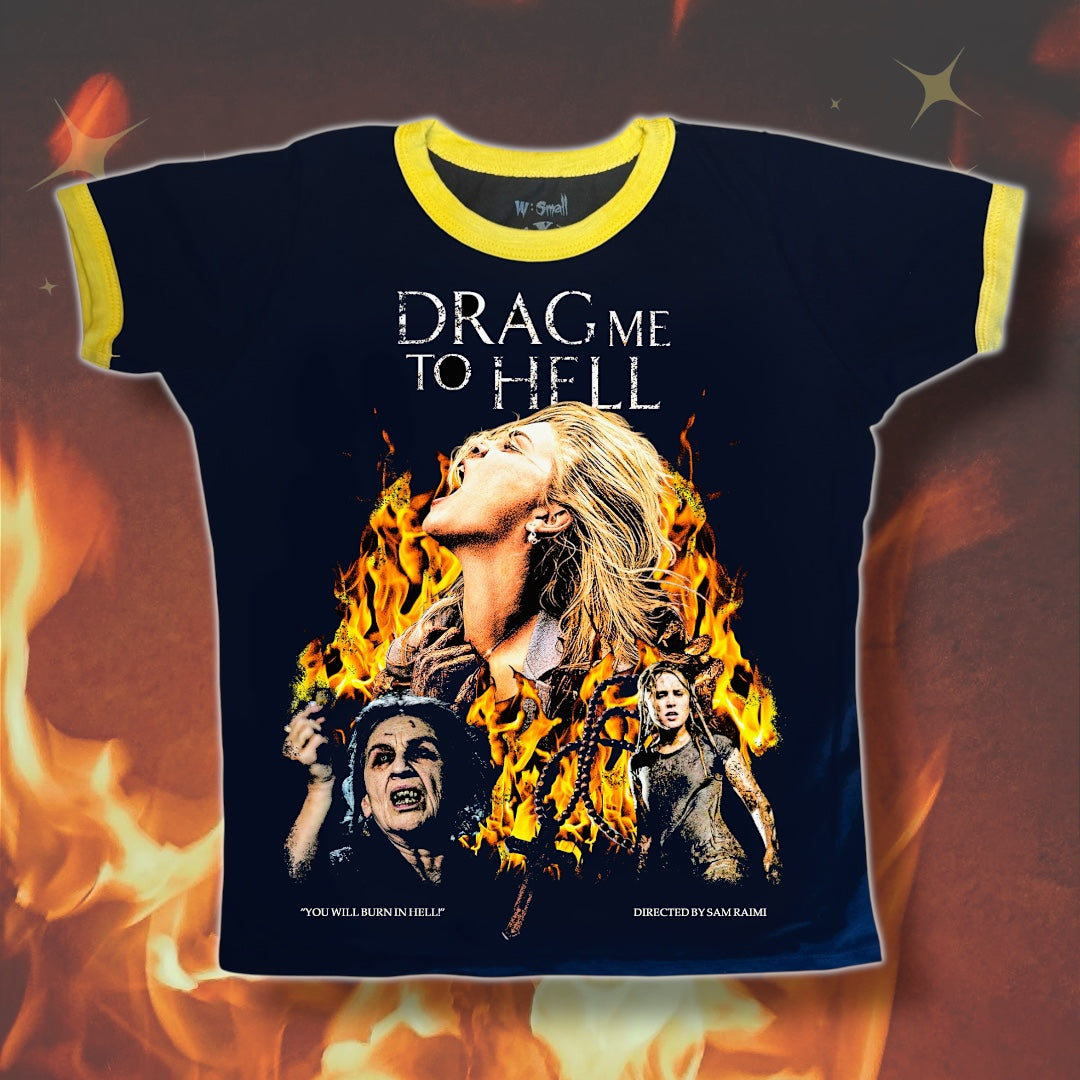 T-shirt with graphic design and text 'DRAG ME TO HELL' on a fiery background