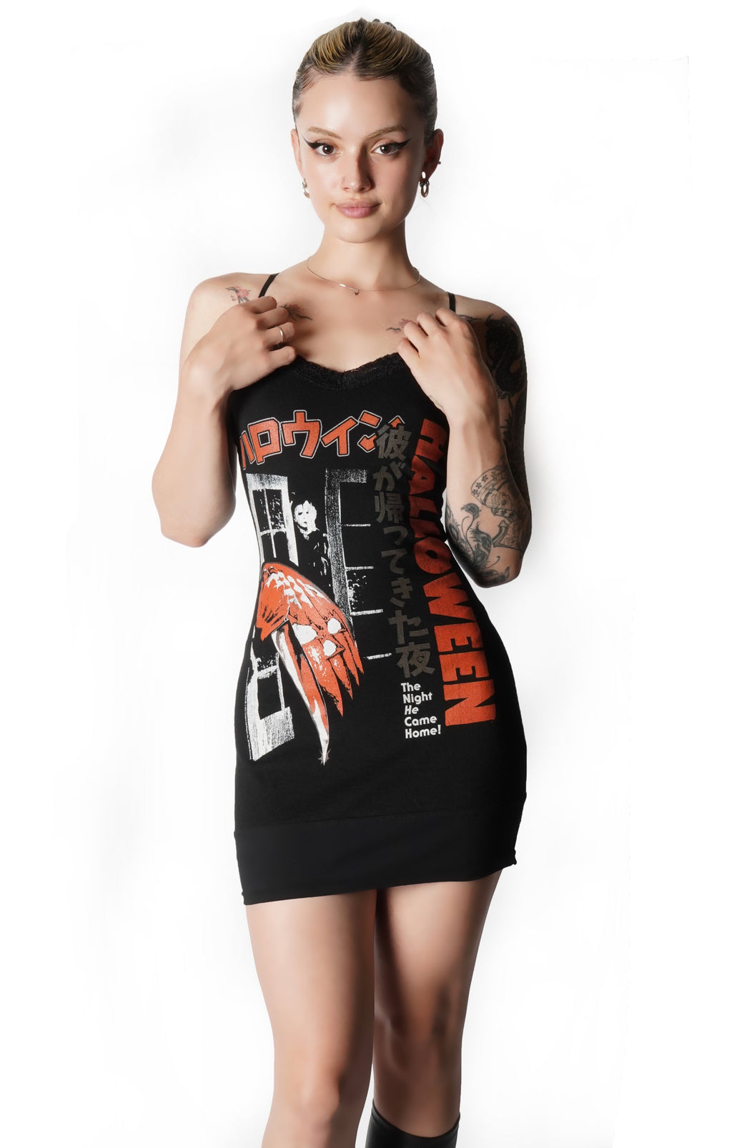 Woman wearing a black dress with graphic design from a Japanese Flyer for the 1978 movie Halloween on a white background